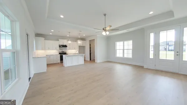 a view of kitchen with sink and microwave