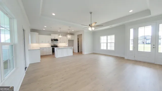 a view of kitchen with sink and microwave