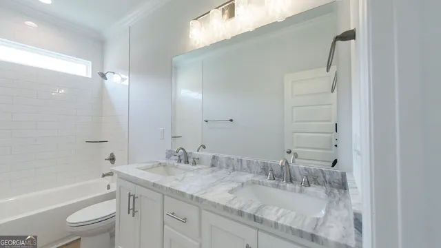 a white bath tub sitting next to a shower