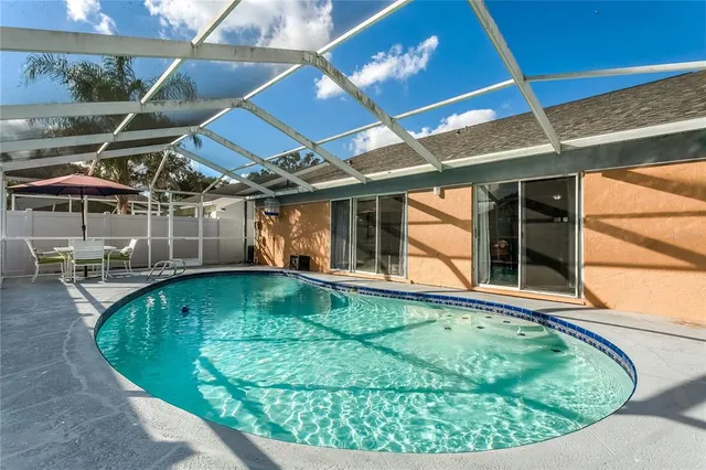 a view of a swimming pool with a patio