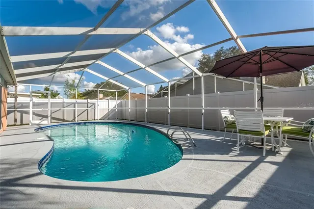 a view of a swimming pool with a patio