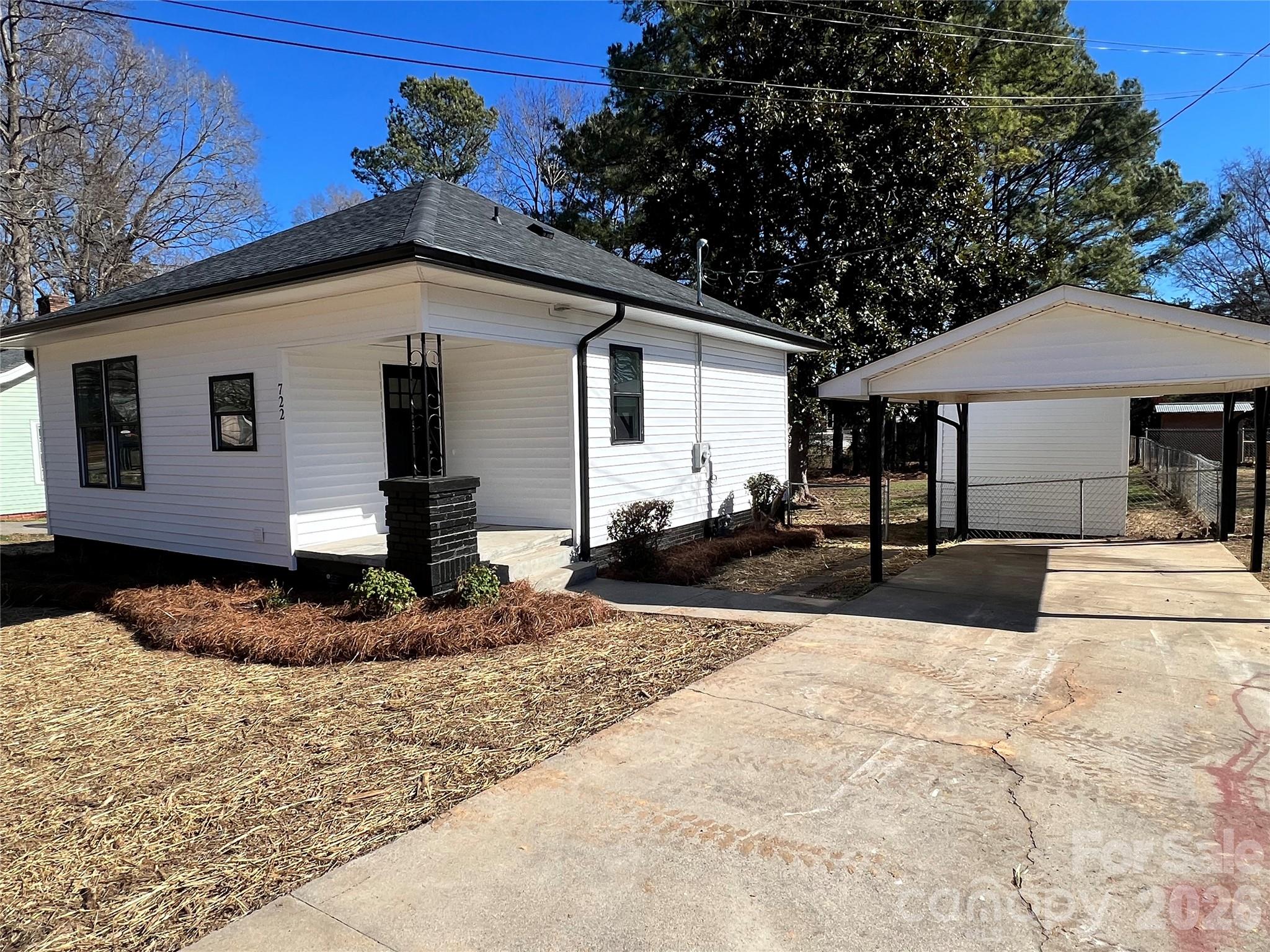 722 Austin Street Albemarle, NC 28001 - Photo 1 of 22 a front view of a house with a yard