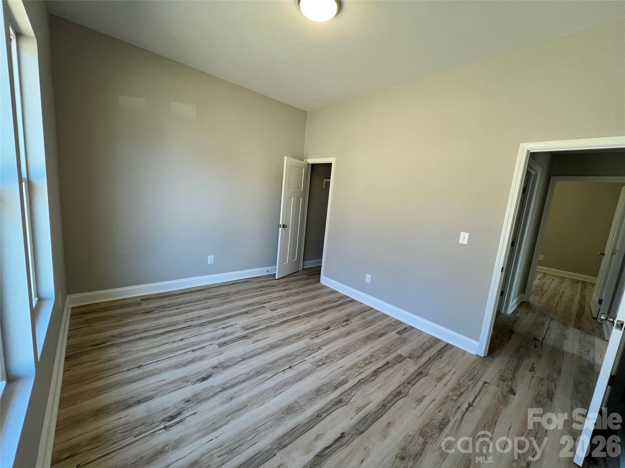 722 Austin Street Albemarle, NC 28001 - Photo 14 of 22 a view of a room with wooden floor
