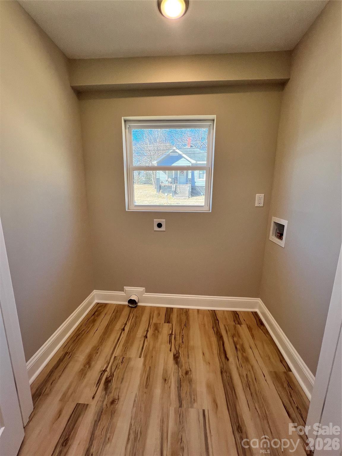 722 Austin Street Albemarle, NC 28001 - Photo 6 of 22 a view of a room with wooden floor and small window
