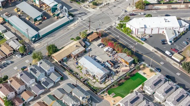 an aerial view of a residential building with an outdoor space