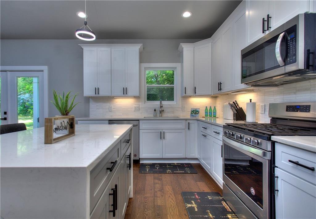 419 Mc Innes Circle Marietta, GA 30060 - Photo 12 of 33 a kitchen with sink a microwave and cabinets