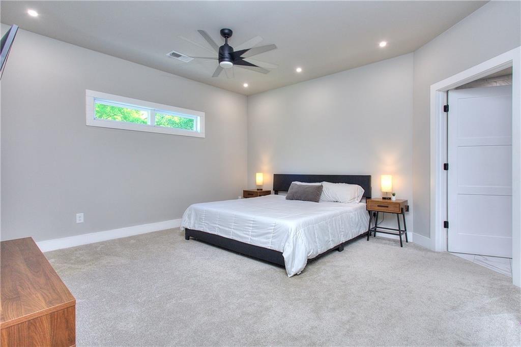 419 Mc Innes Circle Marietta, GA 30060 - Photo 15 of 33 a bedroom with a bed and a chandelier