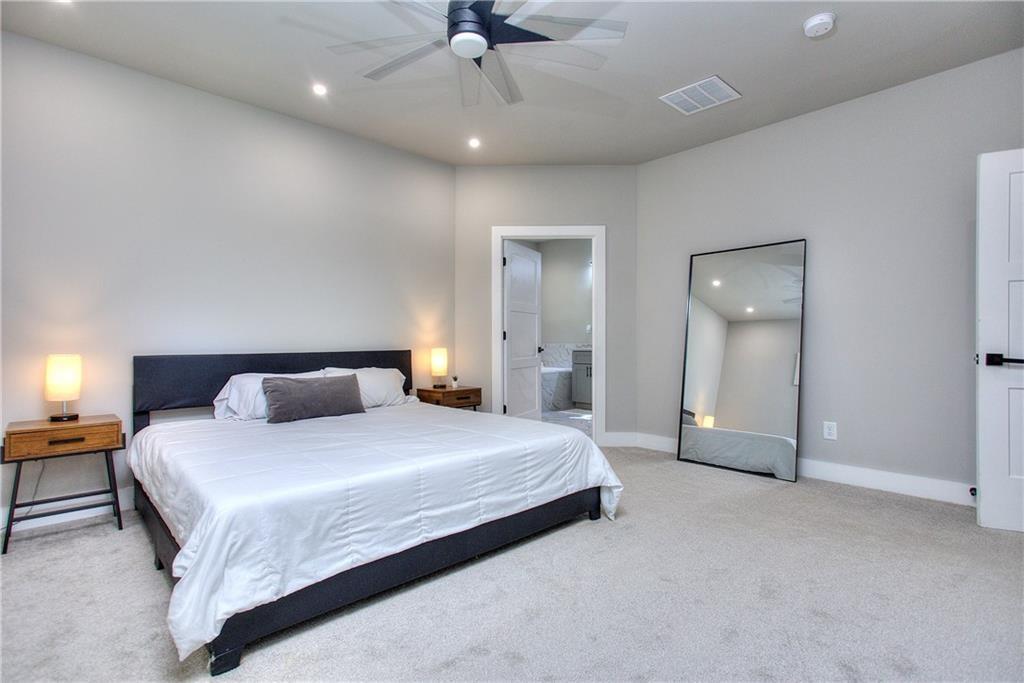 419 Mc Innes Circle Marietta, GA 30060 - Photo 16 of 33 a bedroom with a bed and a chandelier