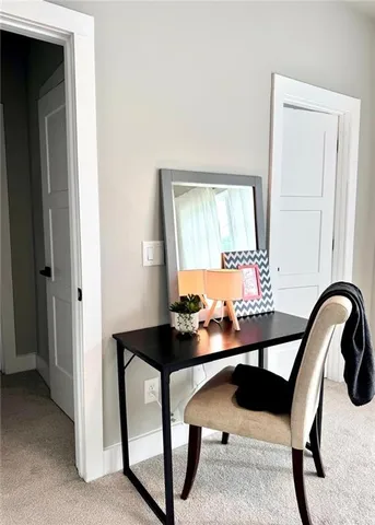 a room with a table and chairs