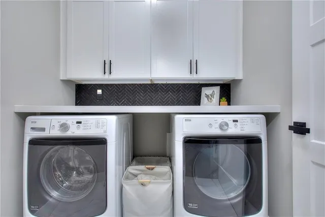 a utility room with dryer and washer