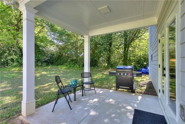 a view of a porch with furniture and yard