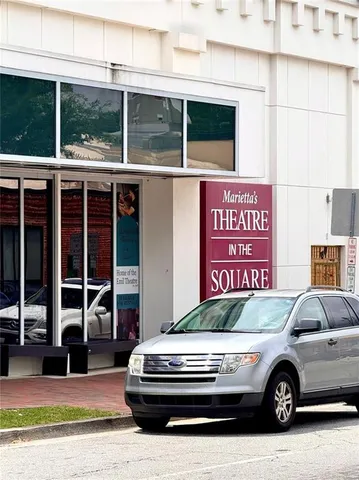 a view of a lake with a building in the background