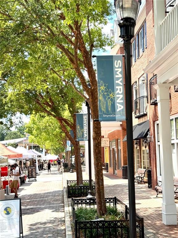 419 Mc Innes Circle Marietta, GA 30060 - Photo 29 of 33 a street sign on a sidewalk next to a building