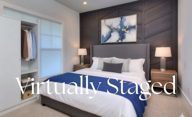 a bedroom with a bed and a mirror