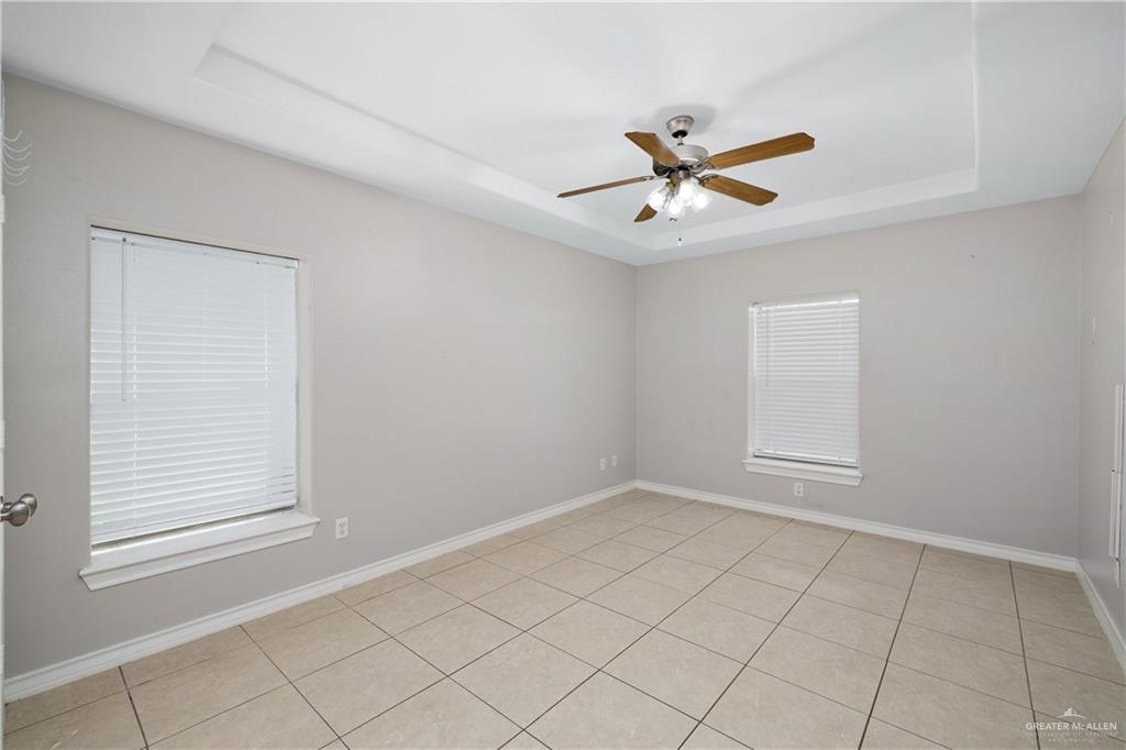 116 Santa Elena Lane Rio Grande City, TX 78582 - Photo 12 of 16 wooden floor in an empty room with a window