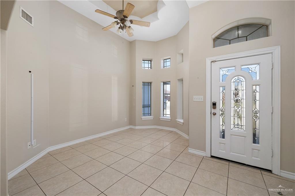 116 Santa Elena Lane Rio Grande City, TX 78582 - Photo 3 of 16 a view of a livingroom with a chandelier fan and windows