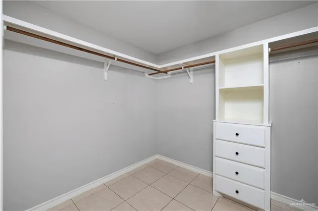 a view of an empty walk in closet