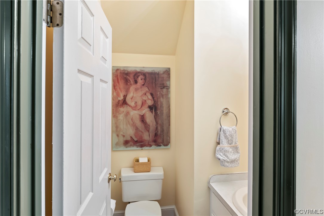 9737 Cole Mill Road Richmond, VA 23237 - Photo 11 of 50 a bathroom with a toilet and a shower curtain