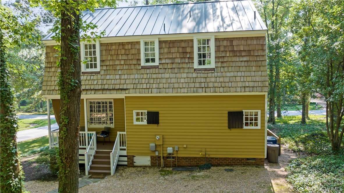 9737 Cole Mill Road Richmond, VA 23237 - Photo 16 of 50 a front view of a house with a garden