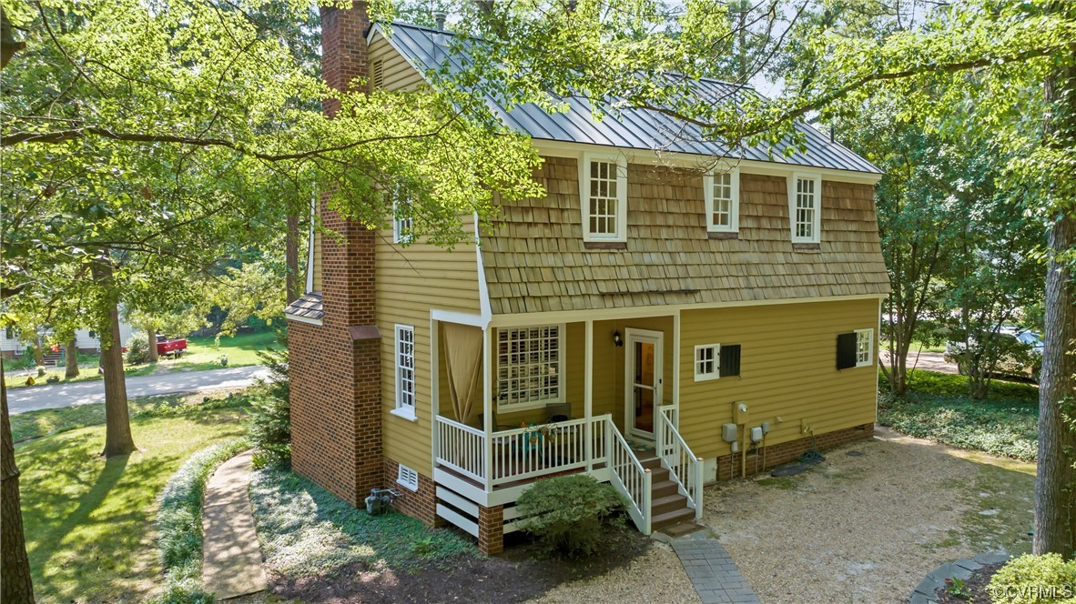 9737 Cole Mill Road Richmond, VA 23237 - Photo 17 of 50 a front view of a house with a yard
