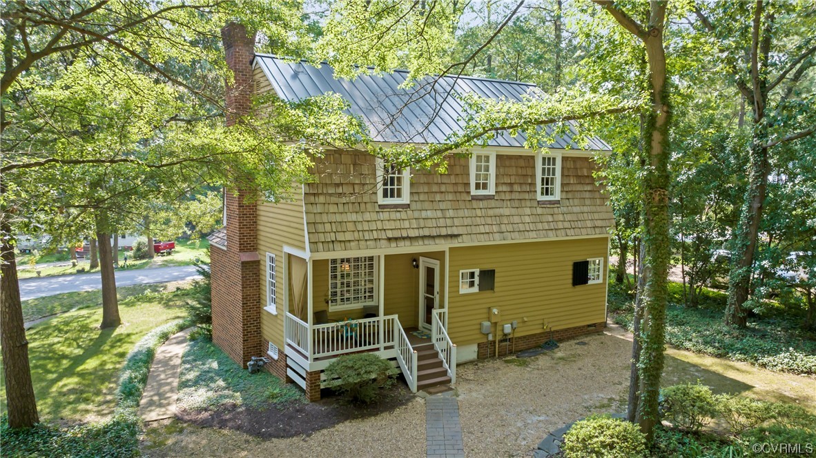 9737 Cole Mill Road Richmond, VA 23237 - Photo 18 of 50 a front view of a house with a yard