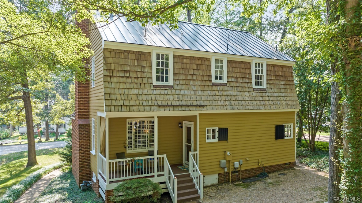 9737 Cole Mill Road Richmond, VA 23237 - Photo 2 of 50 a front view of a house with garden