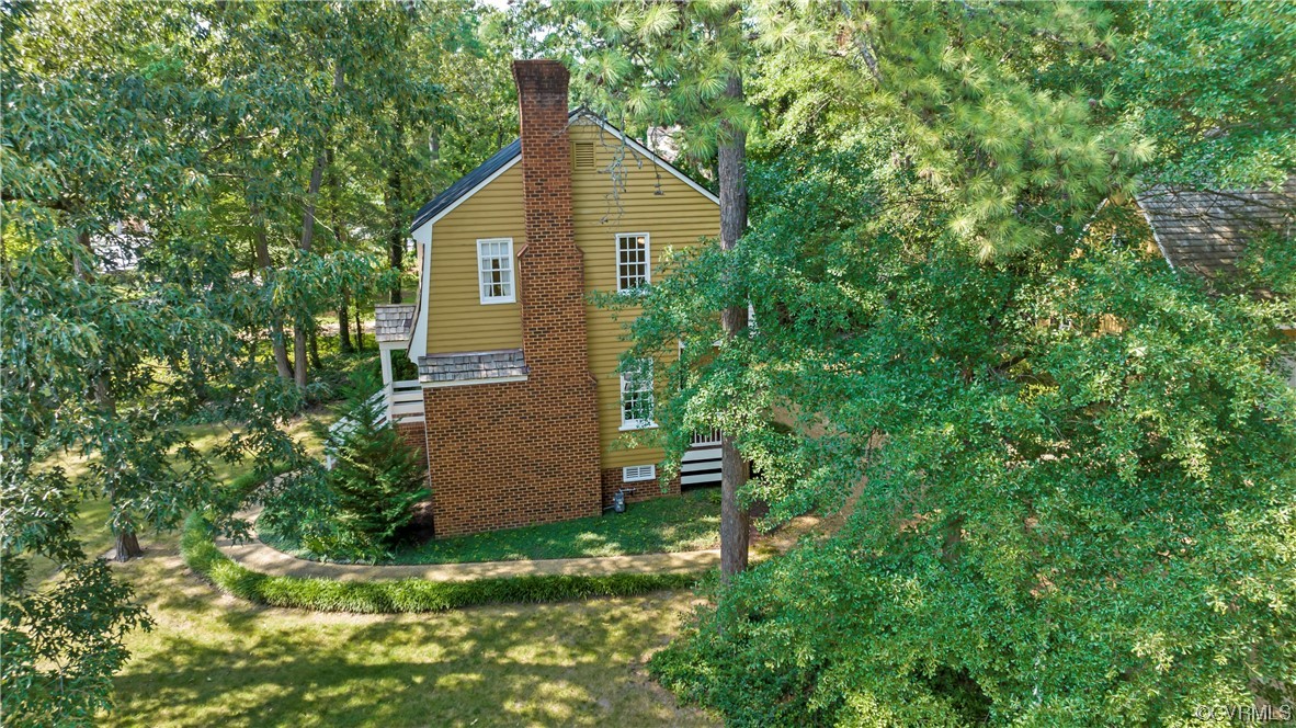 9737 Cole Mill Road Richmond, VA 23237 - Photo 25 of 50 a view of a backyard with plants and large tree
