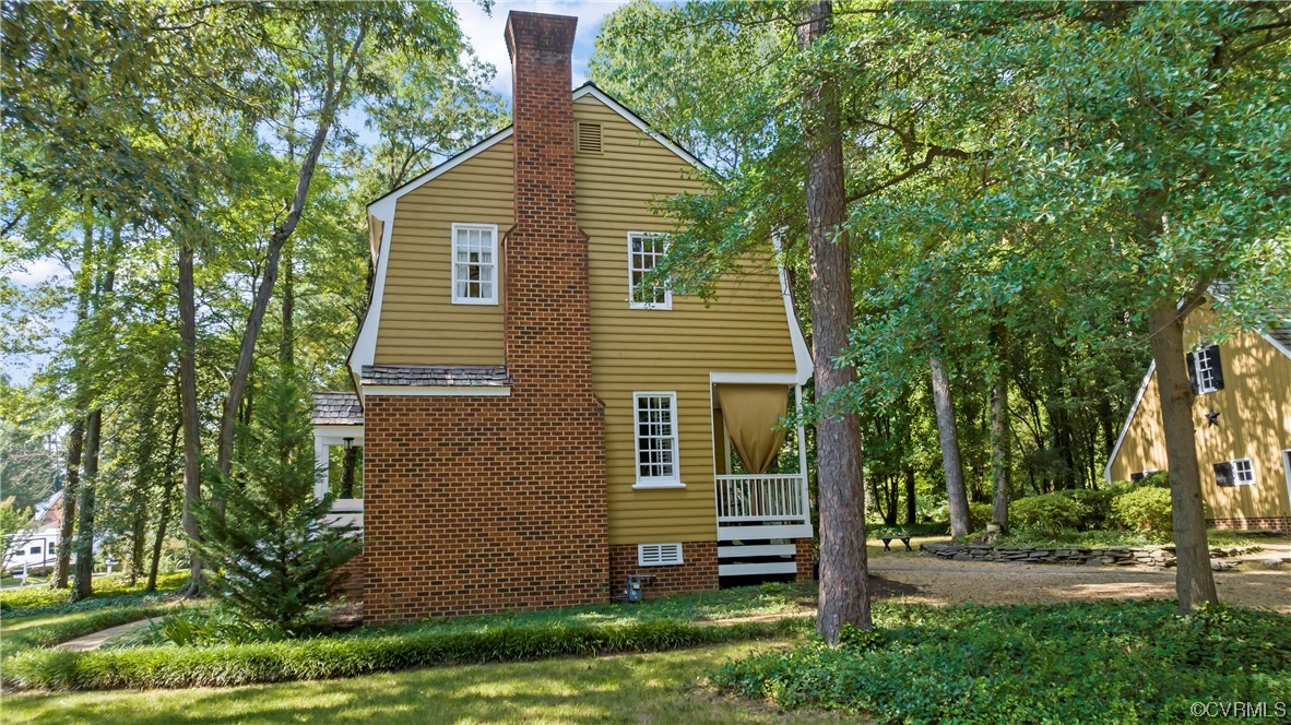 9737 Cole Mill Road Richmond, VA 23237 - Photo 3 of 50 a view of a house with a yard and plants