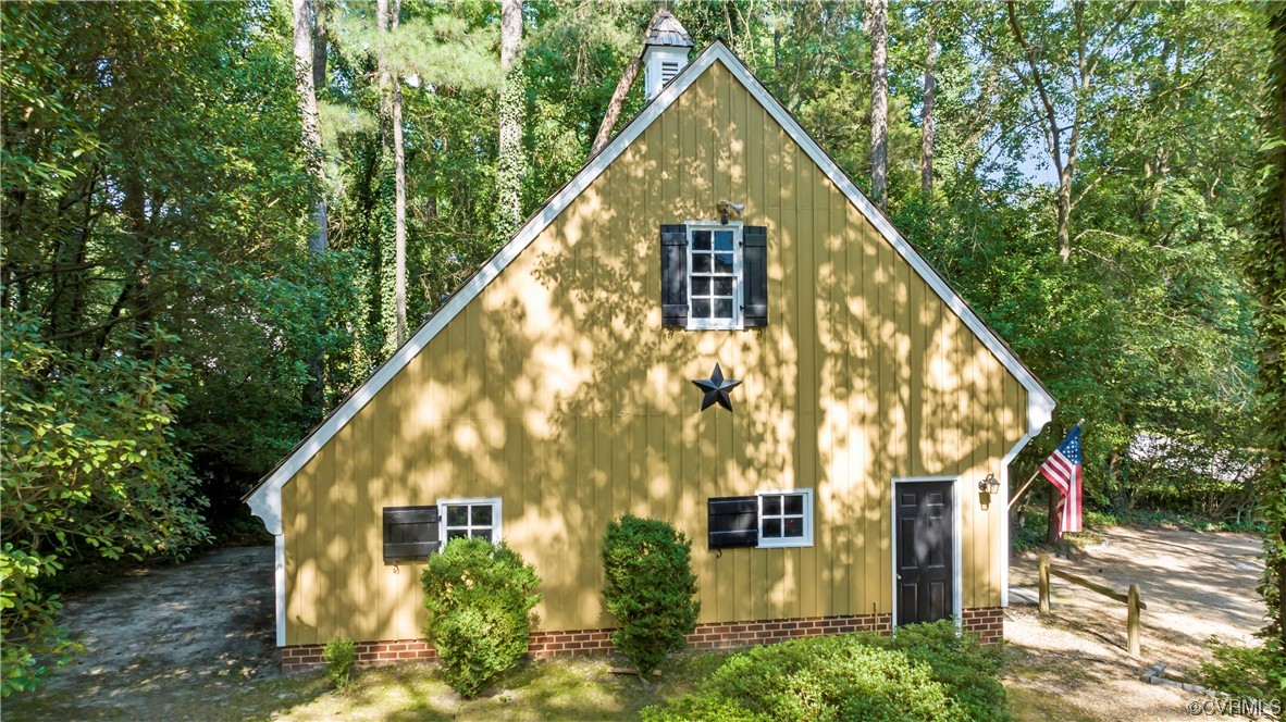 9737 Cole Mill Road Richmond, VA 23237 - Photo 38 of 50 a view of a large house with a small yard