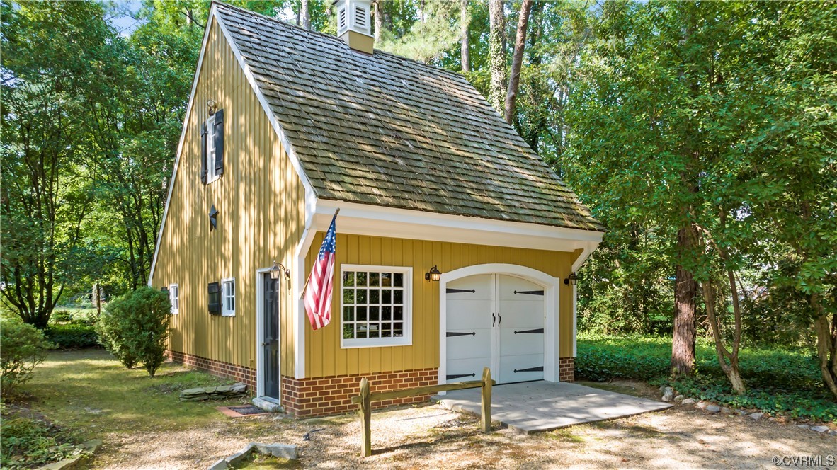 9737 Cole Mill Road Richmond, VA 23237 - Photo 41 of 50 a front view of a house with garden