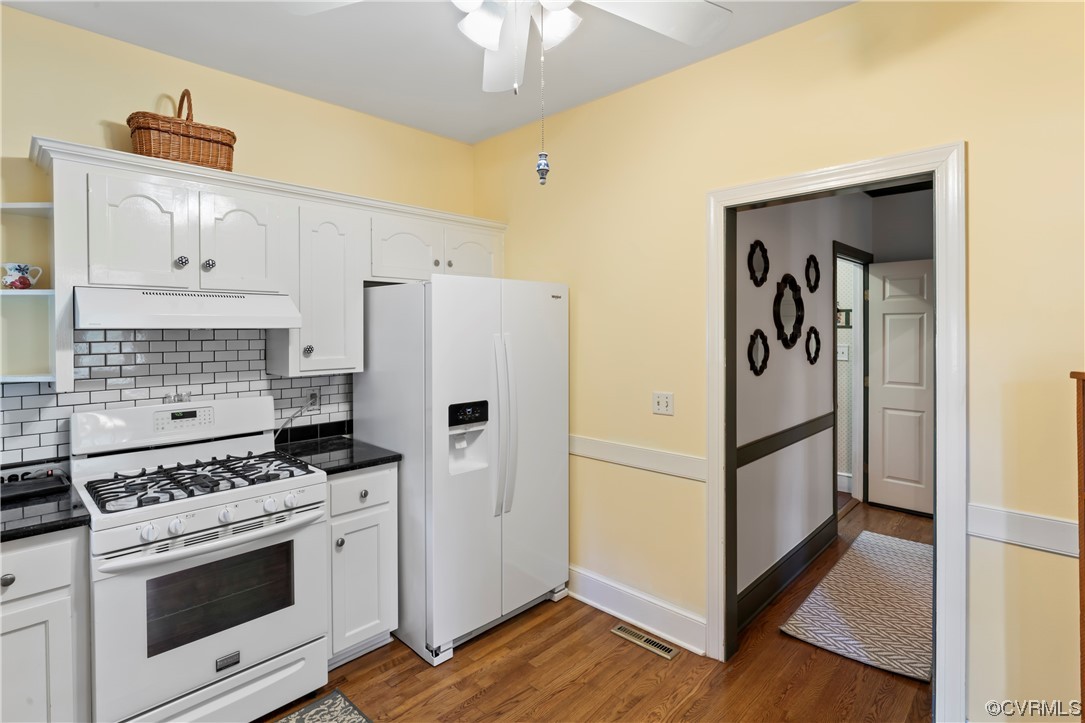 9737 Cole Mill Road Richmond, VA 23237 - Photo 44 of 50 a kitchen with stainless steel appliances a refrigerator a stove and white cabinets