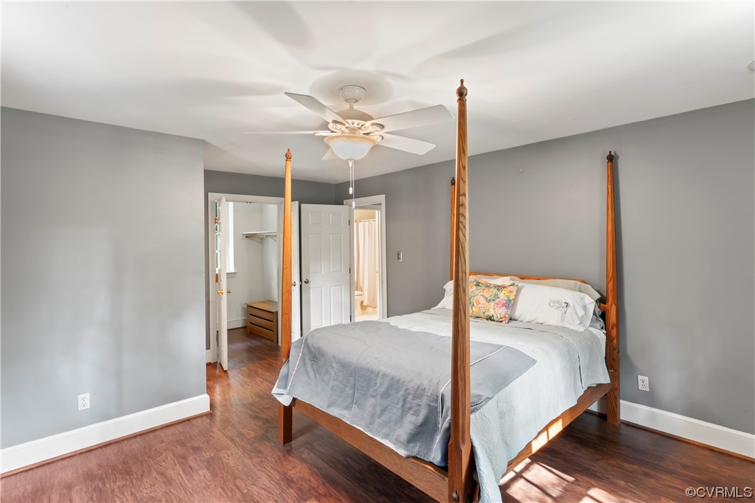 9737 Cole Mill Road Richmond, VA 23237 - Photo 48 of 50 a bedroom with a bed and a chandelier