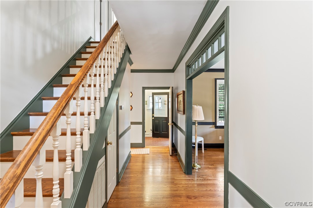 9737 Cole Mill Road Richmond, VA 23237 - Photo 8 of 50 a view of a hallway with wooden floor and staircase