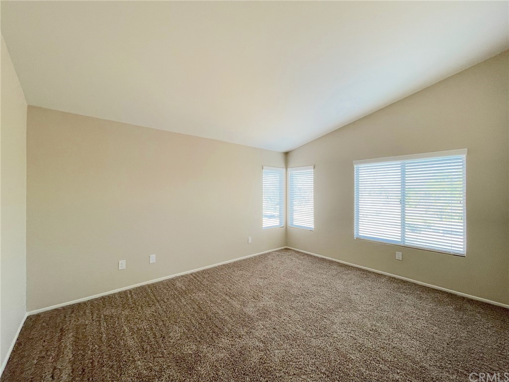 651 Pointe Vista Lane Corona, CA 92881 - Photo 12 of 19 an empty room with a empty space and windows