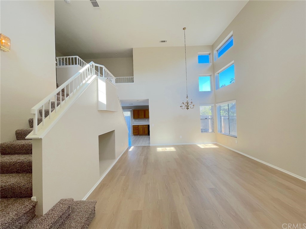 651 Pointe Vista Lane Corona, CA 92881 - Photo 3 of 19 a view of an entryway with wooden floor