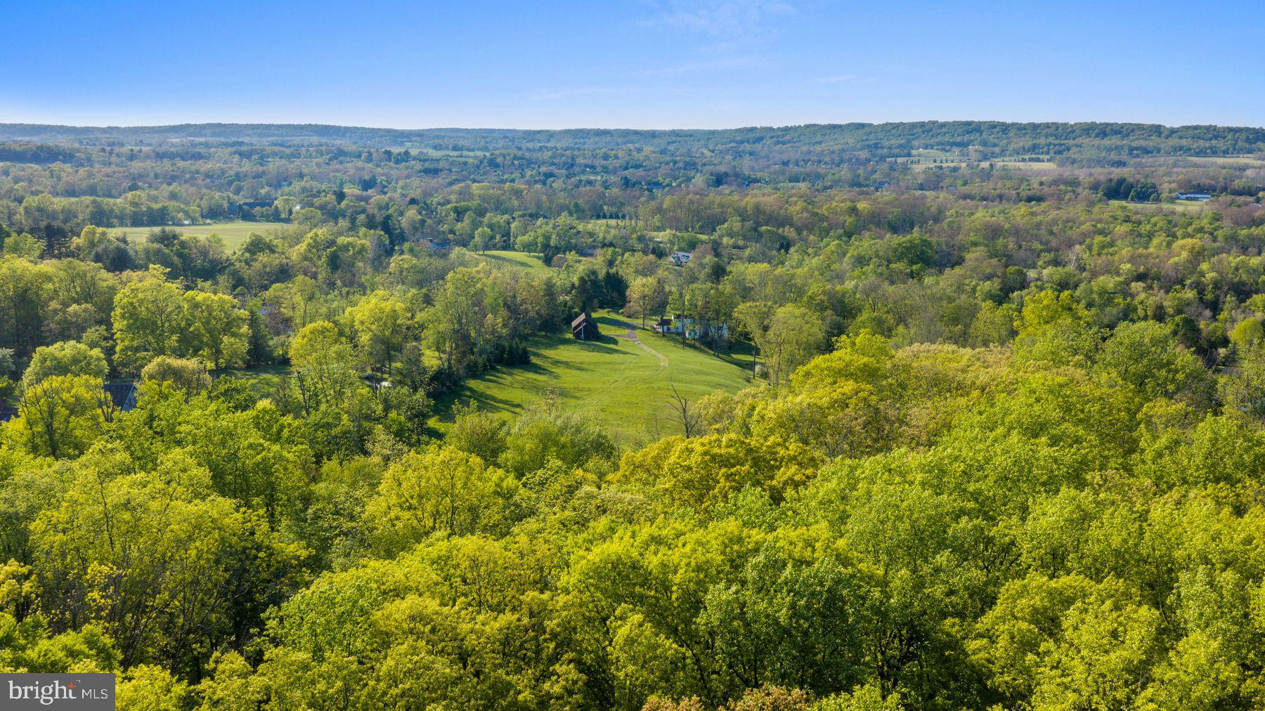 324 Thompson Mill Road New Hope, PA 18938 - Photo 2 of 23 a view of a city with lush green forest