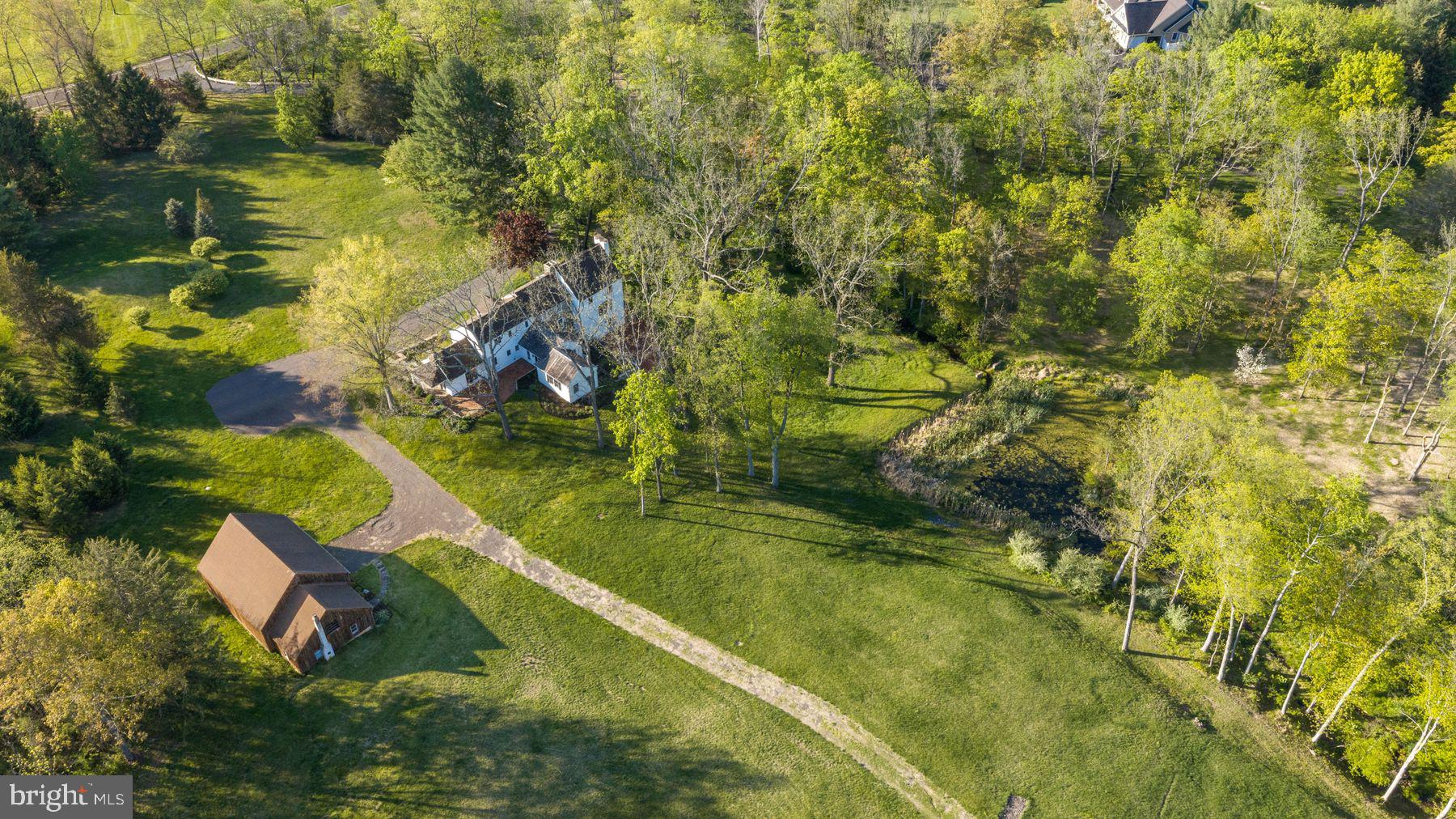 324 Thompson Mill Road New Hope, PA 18938 - Photo 6 of 23 a view of swimming pool from a lake view
