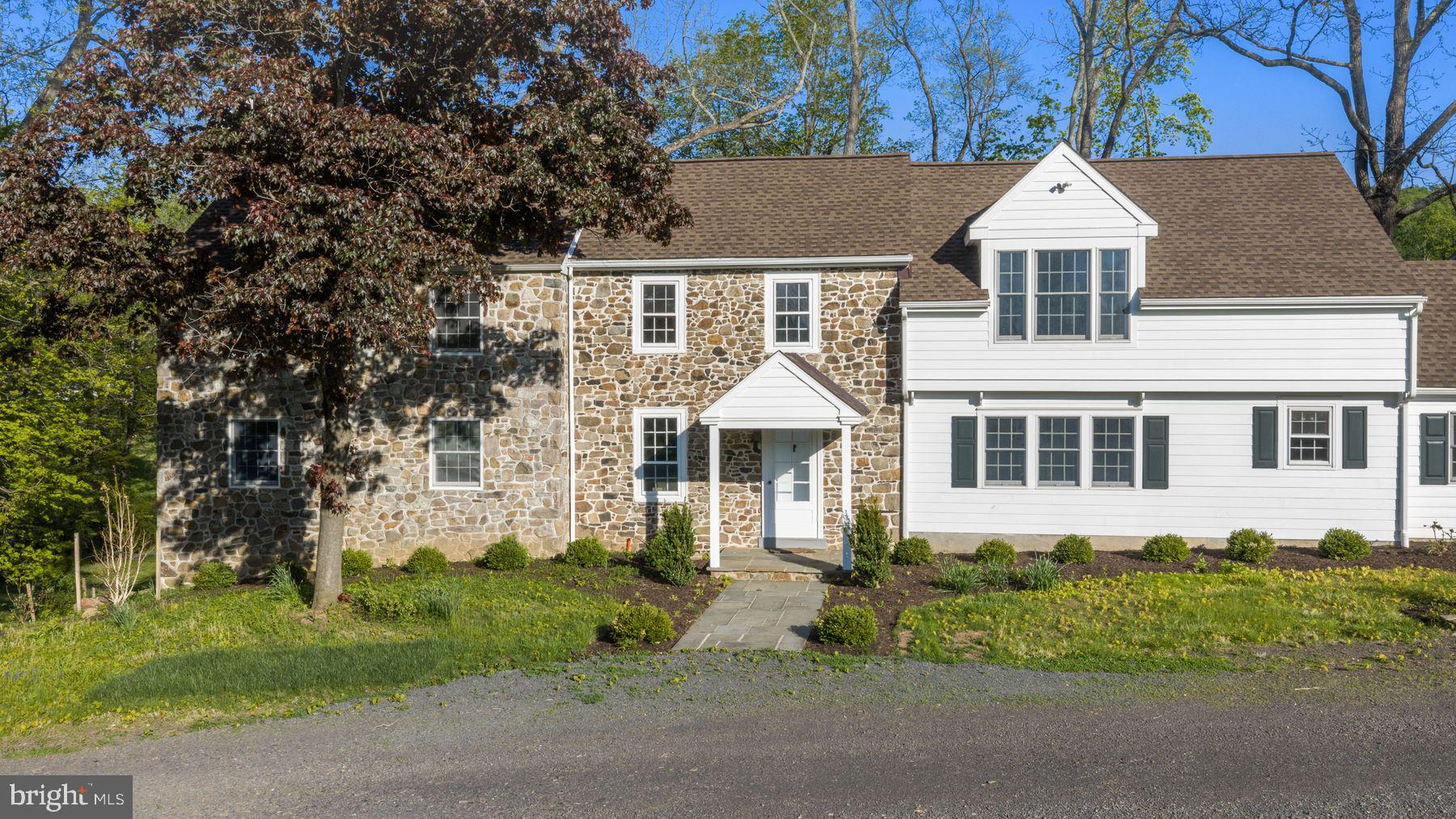 324 Thompson Mill Road New Hope, PA 18938 - Photo 7 of 23 a front view of a house with a yard