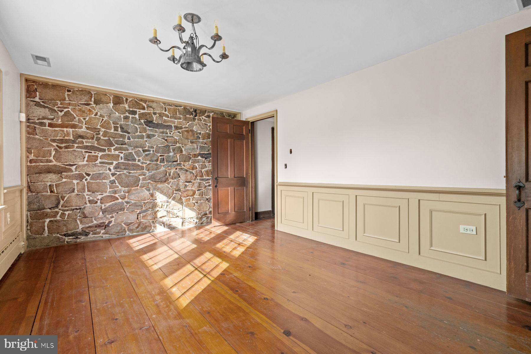 324 Thompson Mill Road New Hope, PA 18938 - Photo 8 of 23 a view of an empty room with wooden floor
