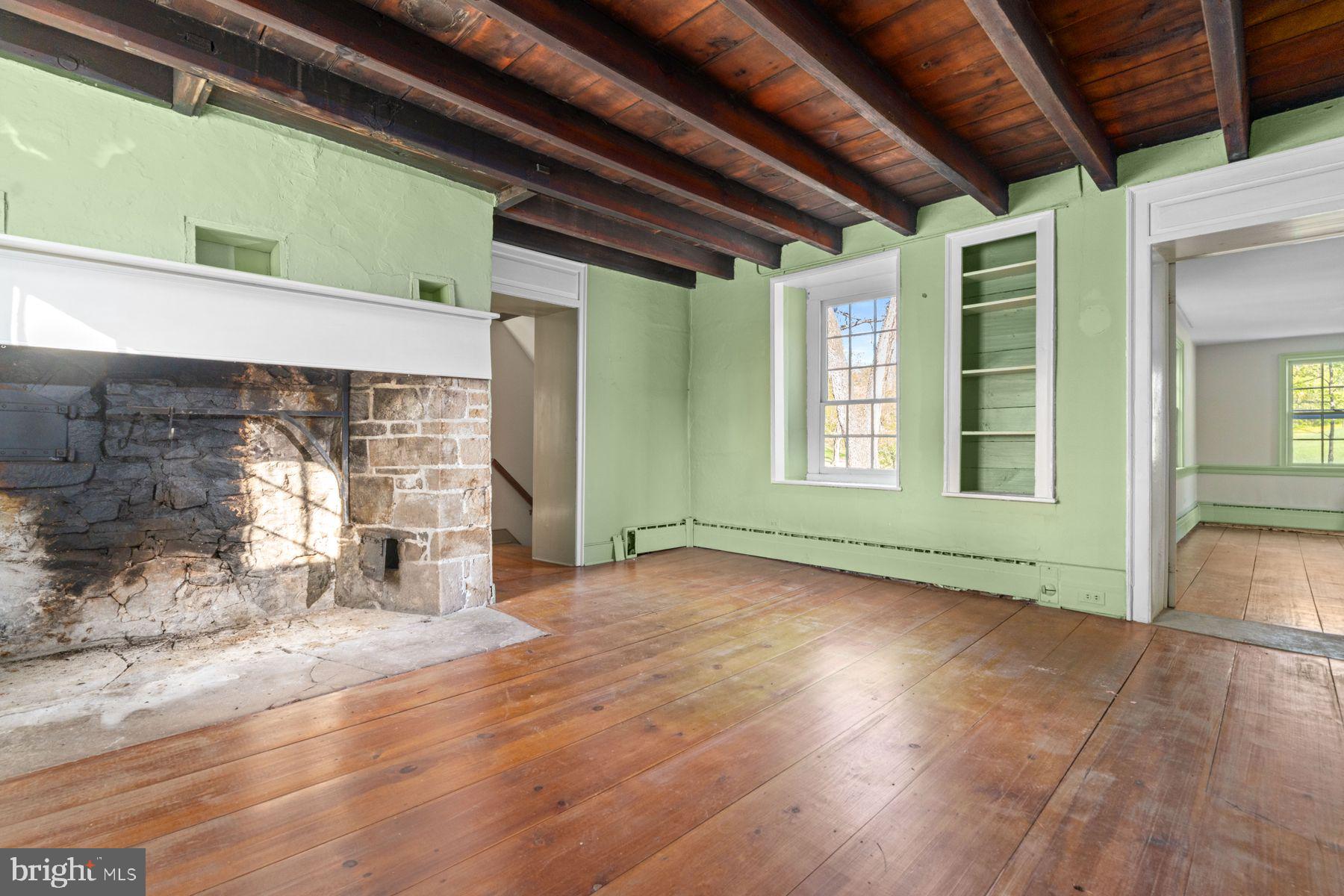 324 Thompson Mill Road New Hope, PA 18938 - Photo 9 of 23 a view of empty room with wooden floor and fan