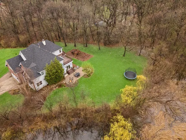 a view of a big yard with a house in the background