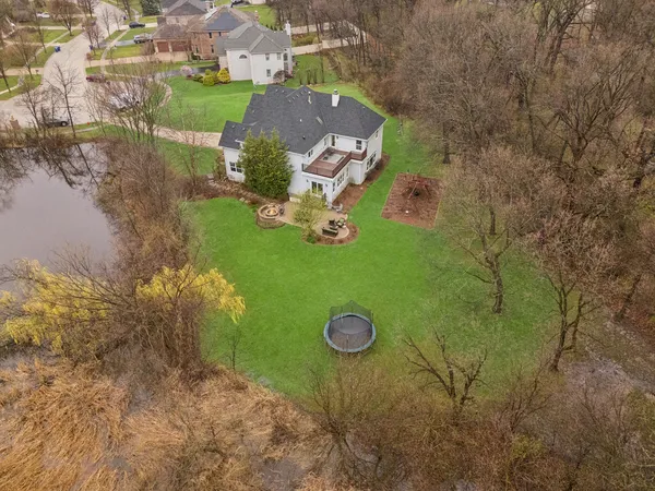 a view of a backyard with sitting area