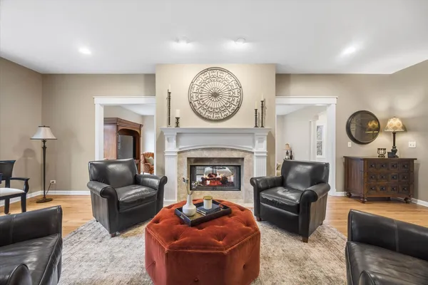 a large kitchen with a table and chairs
