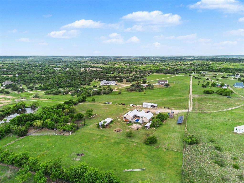 6694 Hutcheson Hill Road Springtown, TX 76082 - Photo 35 of 37 a view of a golf course with an outdoor space