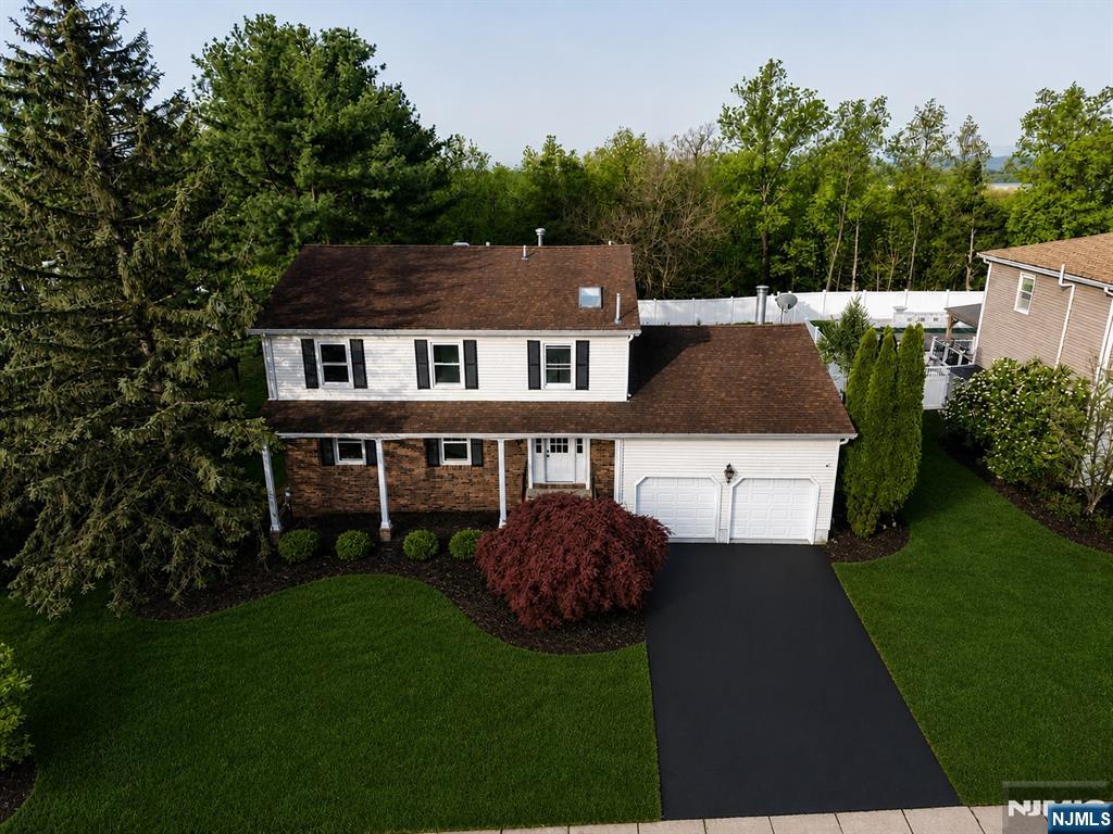 76 Point View Parkway Wayne, NJ 07470 - Photo 1 of 44 a front view of a house with garden