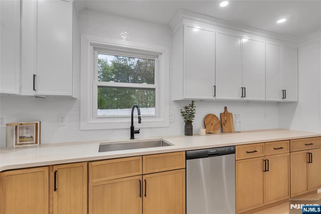 76 Point View Parkway Wayne, NJ 07470 - Photo 14 of 44 a kitchen with stainless steel appliances granite countertop white cabinets a sink and a window