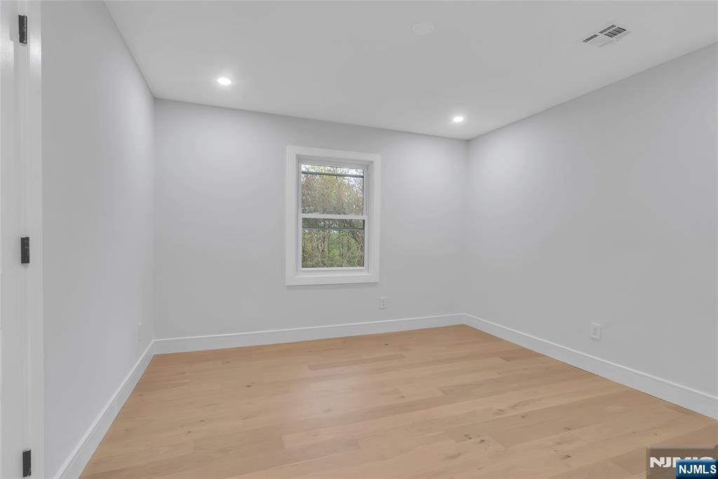 76 Point View Parkway Wayne, NJ 07470 - Photo 22 of 44 an empty room with a window