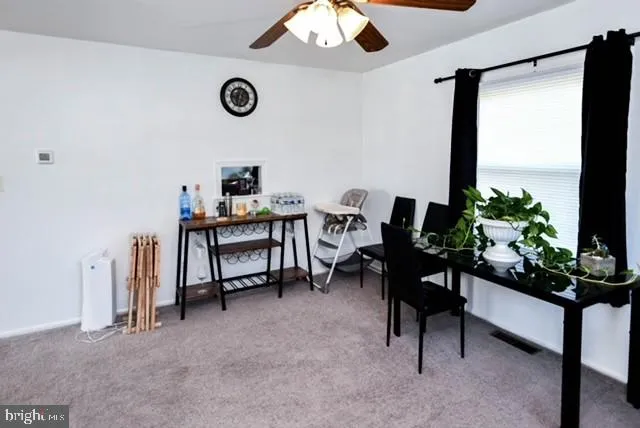 a view of a workspace with furniture