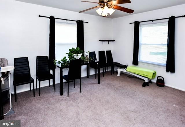 120 Old Enterprise Road, Unit 115 Upper Marlboro, MD 20774 - Photo 12 of 43 a living room with furniture and a chandelier