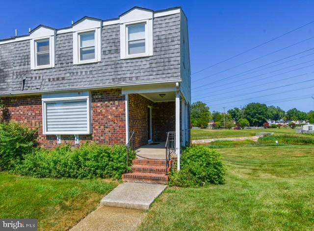 120 Old Enterprise Road, Unit 115 Upper Marlboro, MD 20774 - Photo 2 of 43 a front view of a house with garden